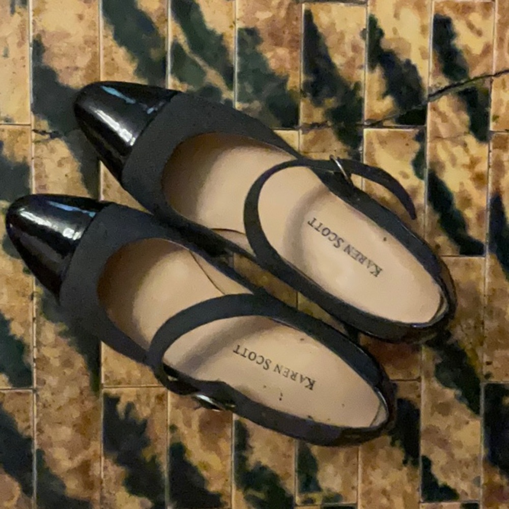 These Karen Scott heels are a size six. They are dark grey with a black tip
